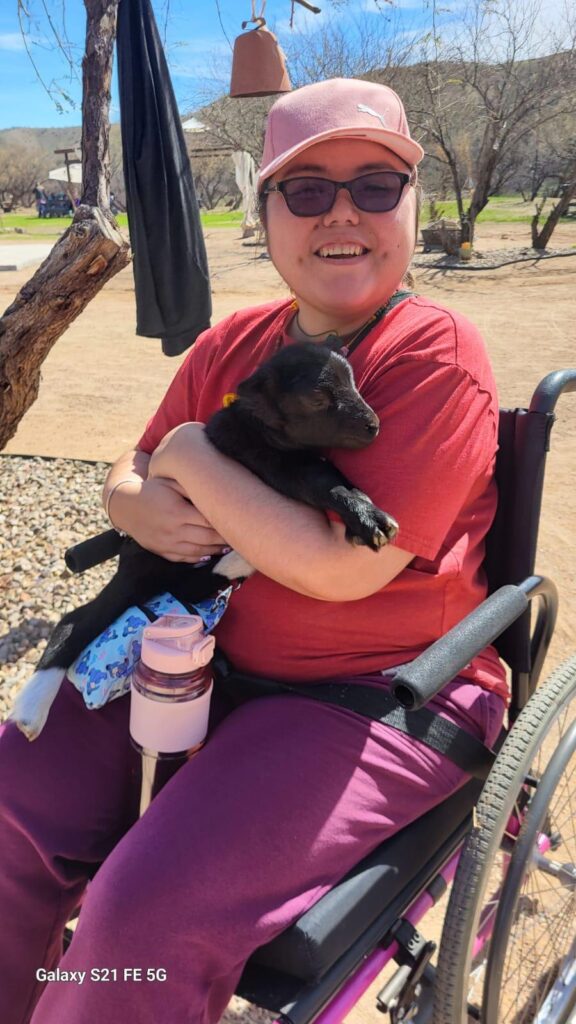 Playing with the baby goats at 4A's Ranch