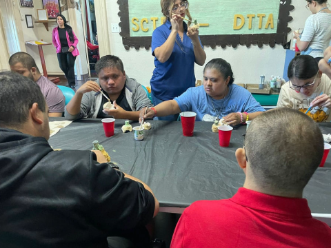 DTTA working on painting clay sculptures