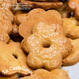 Flower shaped cookies enfused with orange flavor.