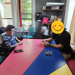 Two young men playing a card game